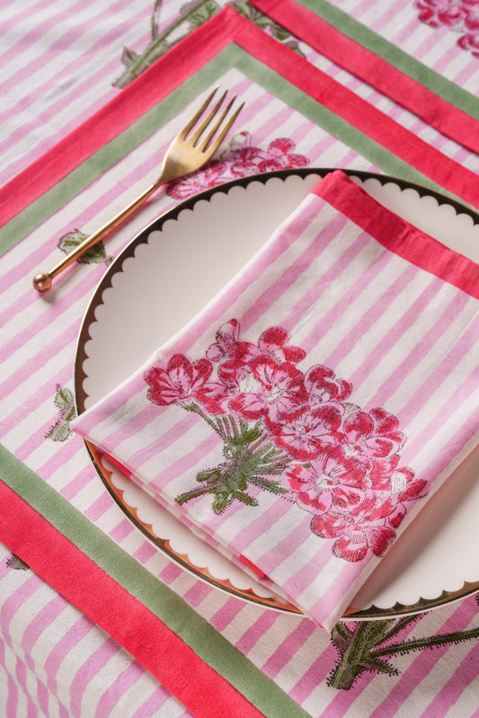 Set of pink striped blockprint napkins with hydrangea flowers and red-edged border