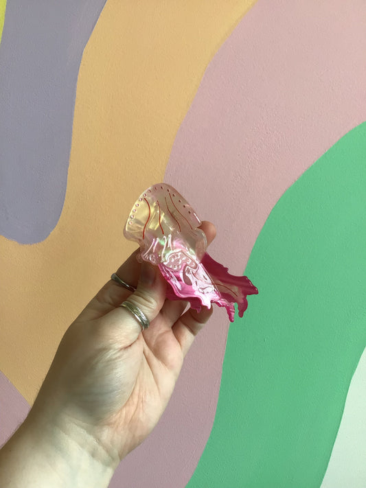 Pink jellyfish hair claw with two prongs, translucent pink glow