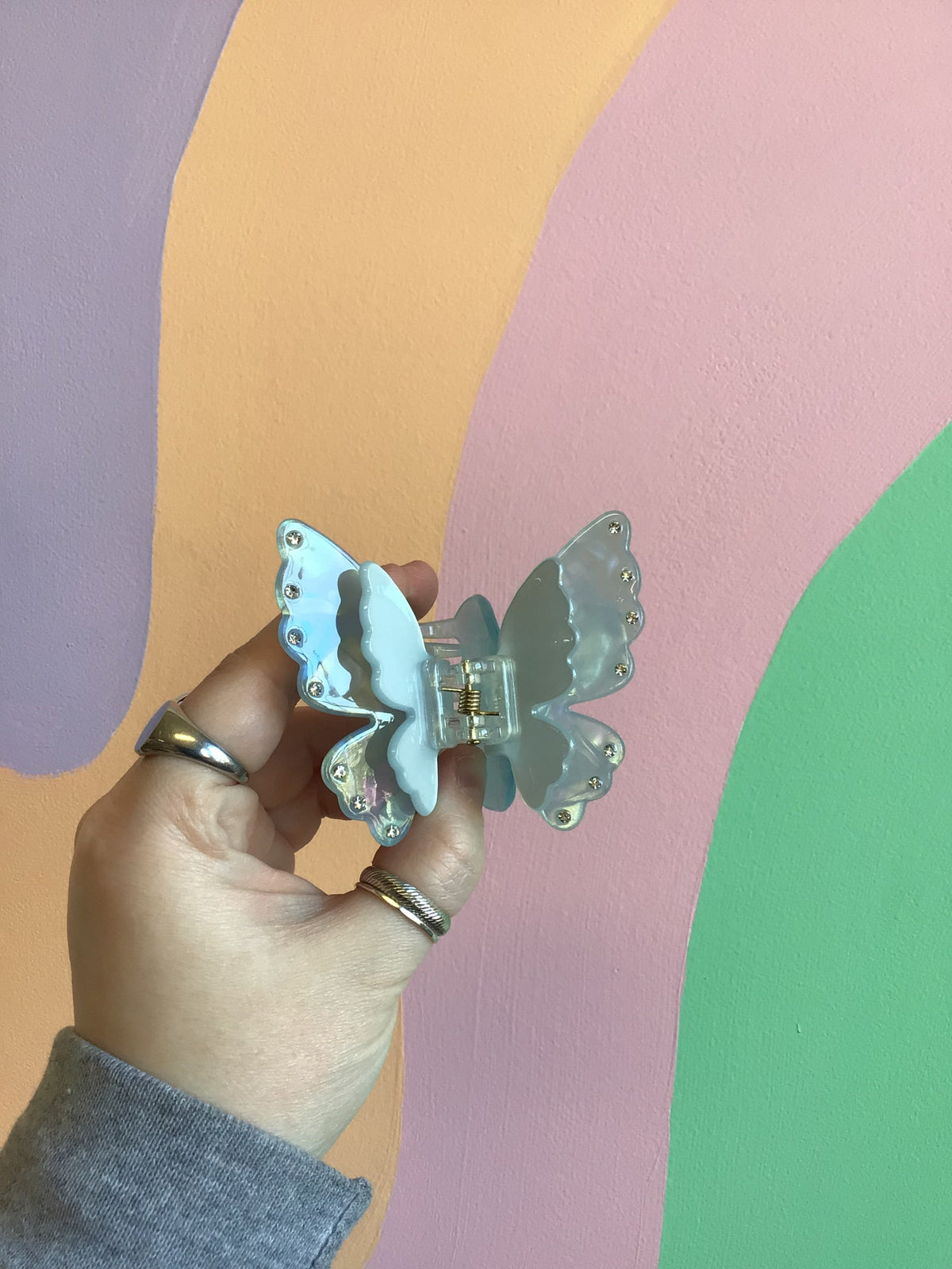 Butterfly hair claw with light blue wings and jeweled edge, silver comb clip