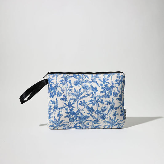Blue and white toile laptop sleeve with black strap and zipper closure