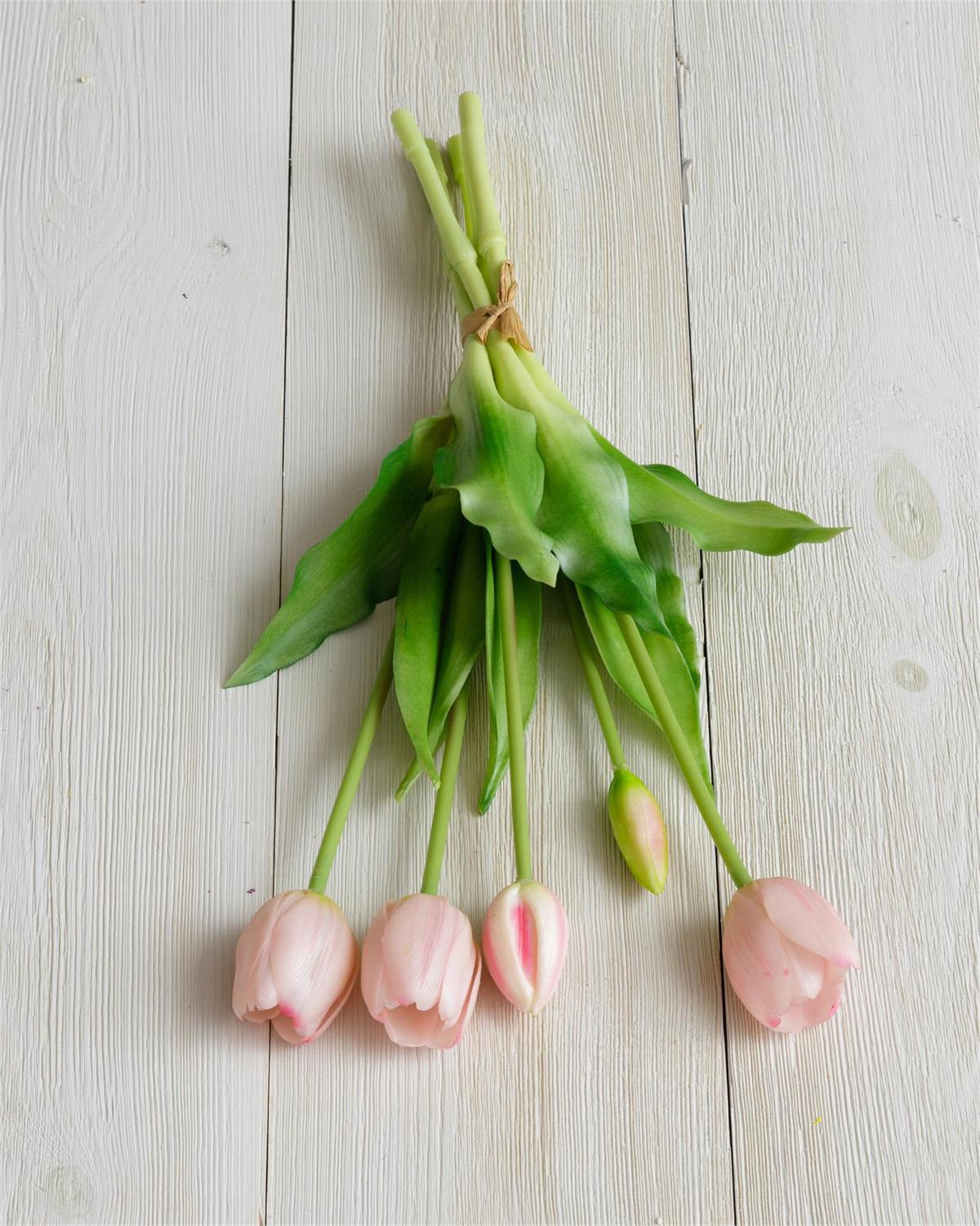 Light pink tulip bouquet with green stems and leaves