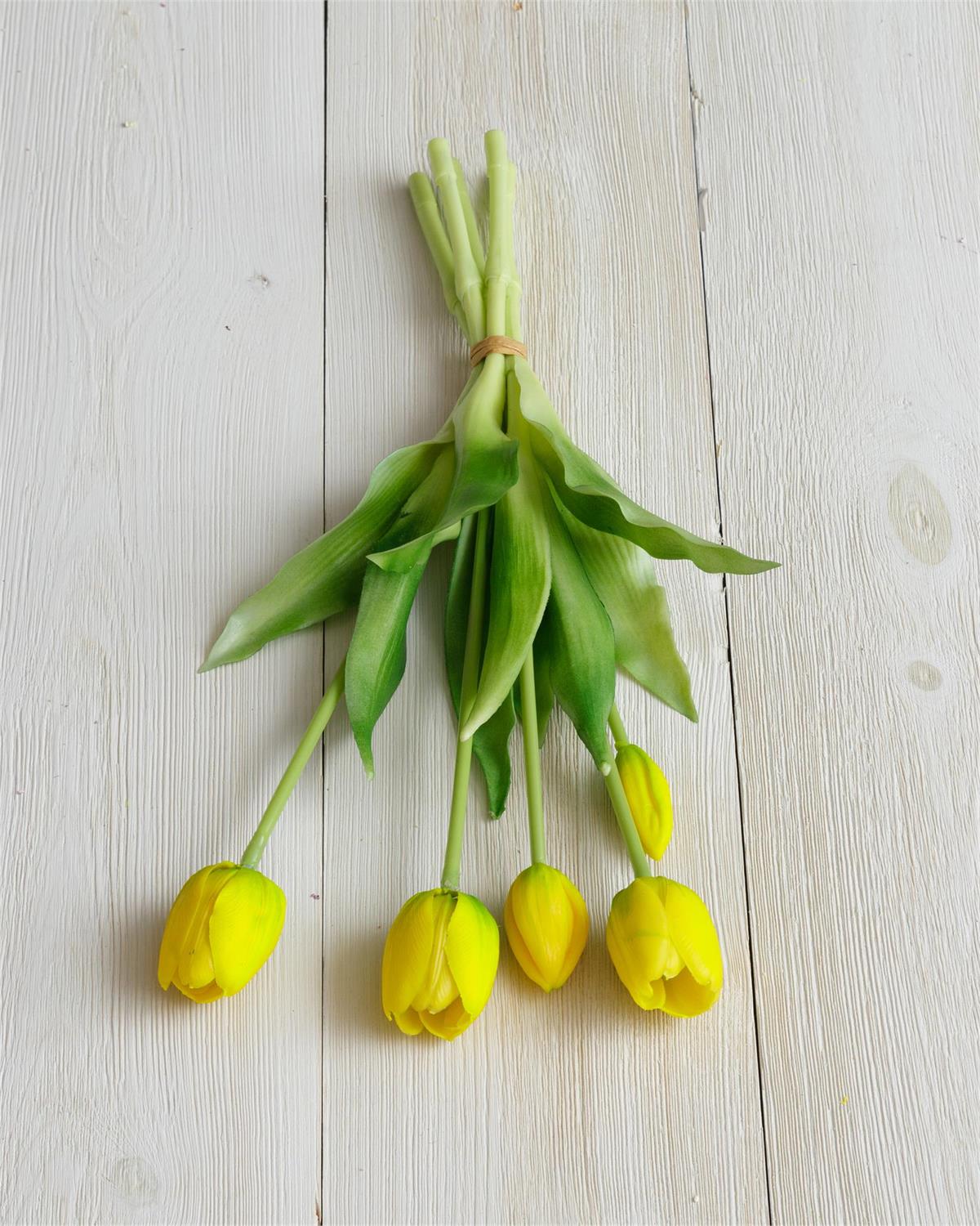Yellow tulip bouquet with green stems and leaves