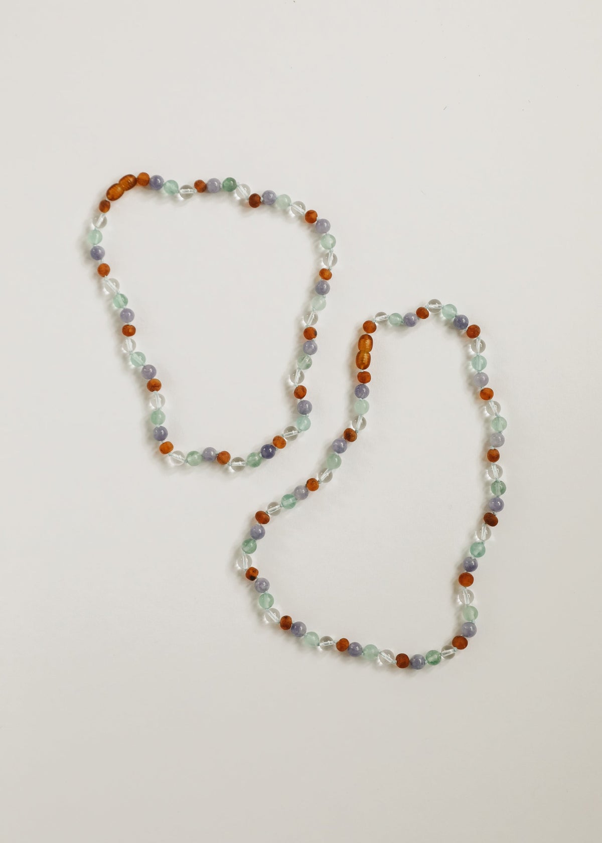 Double-layer beaded gemstone necklace with orange amber, mint, and lilac beads
