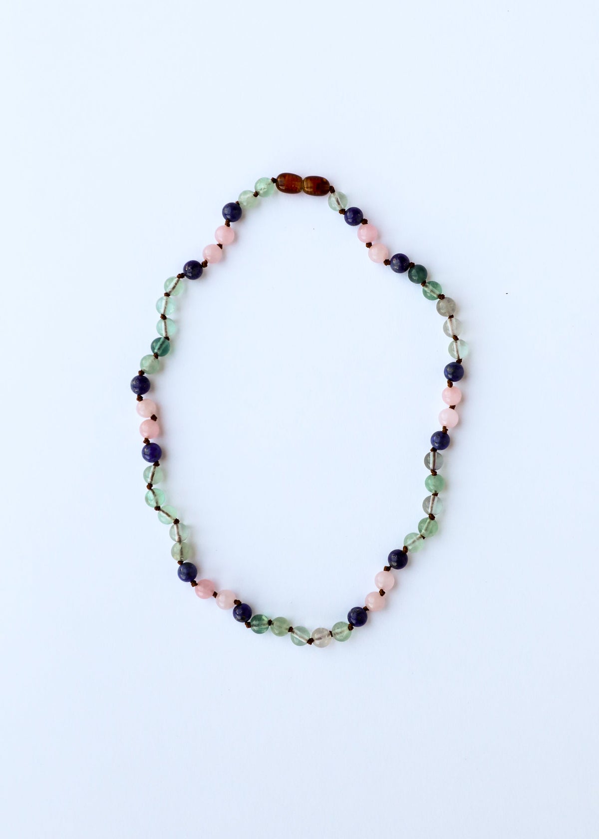 Gemstone bead necklace, oval strand with green, pink, dark blue, and amber beads