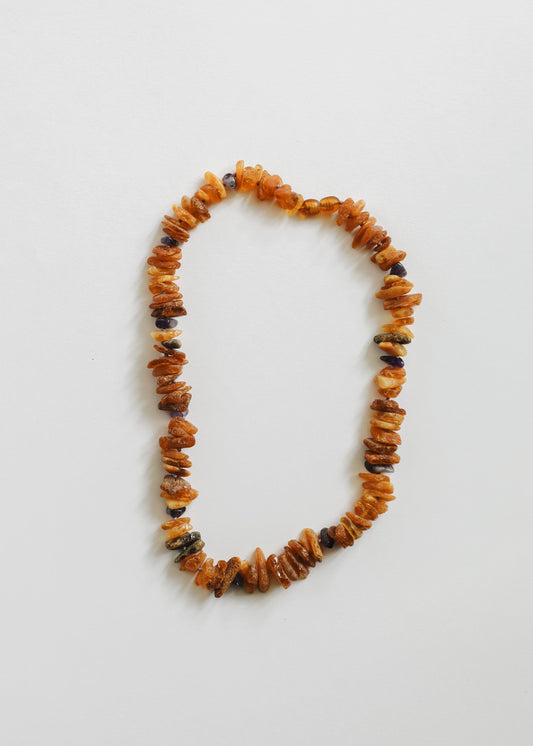 Raw amber and amethyst pet bead necklace with orange amber chips and dark rough stones