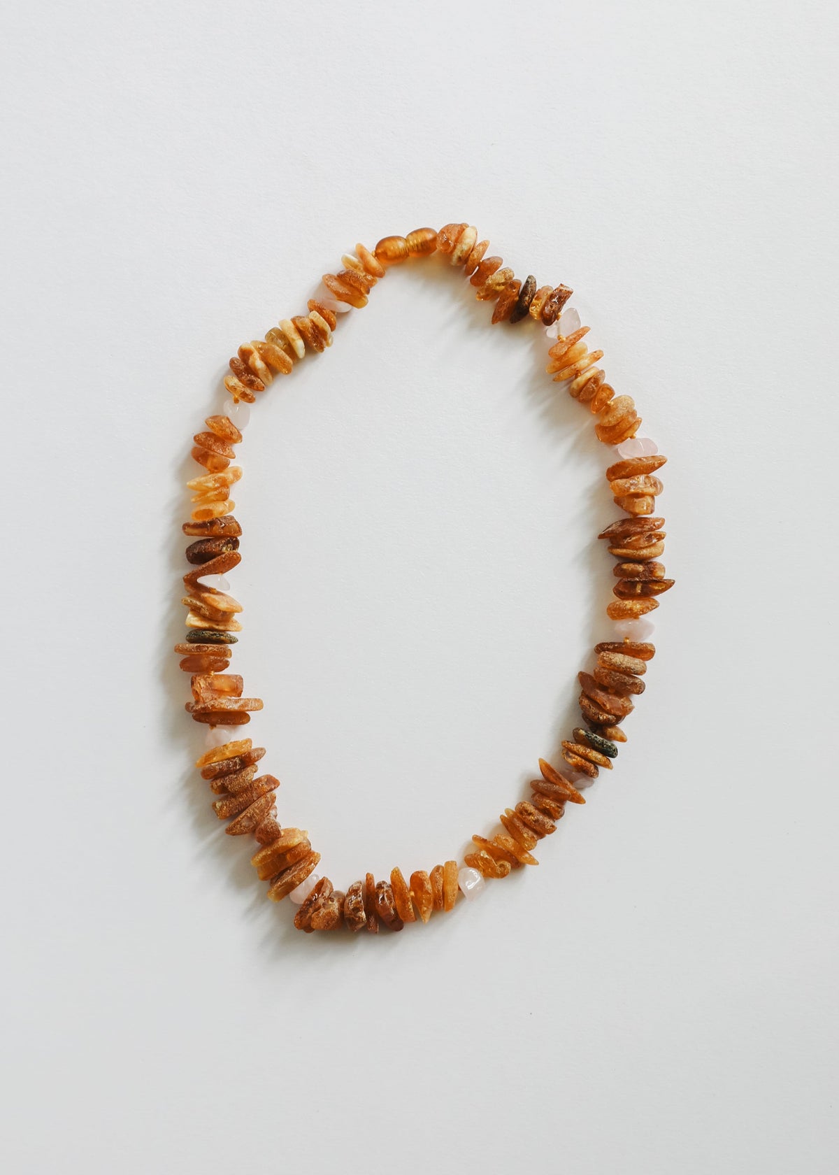 Raw amber and rose quartz pet necklace with orange and pink stone chip beads