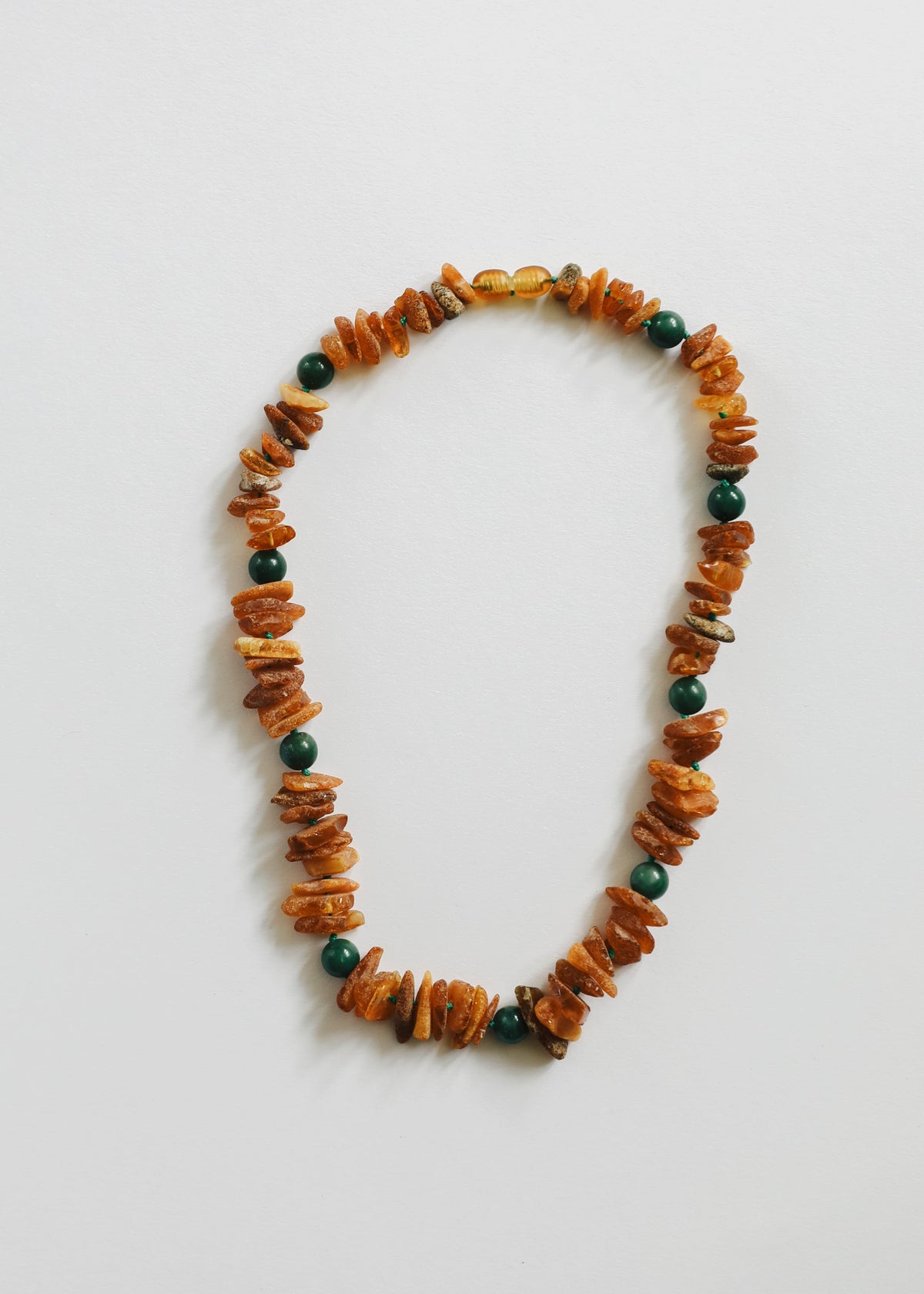 Pet amber and green jade bead necklace with raw chip stones, looped collar
