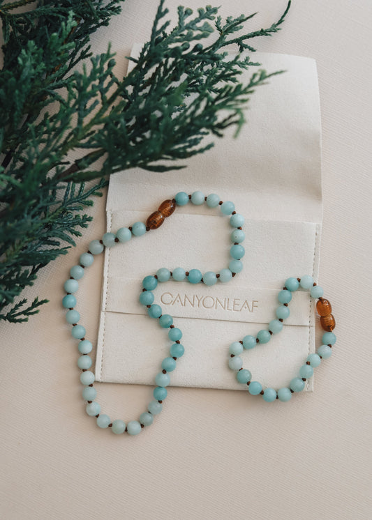 Beaded amazonite bracelet and necklace set with amber accent beads on display card