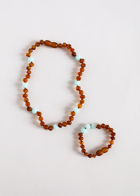Single-strand cognac amber bead necklace with light blue amazonite spacer beads