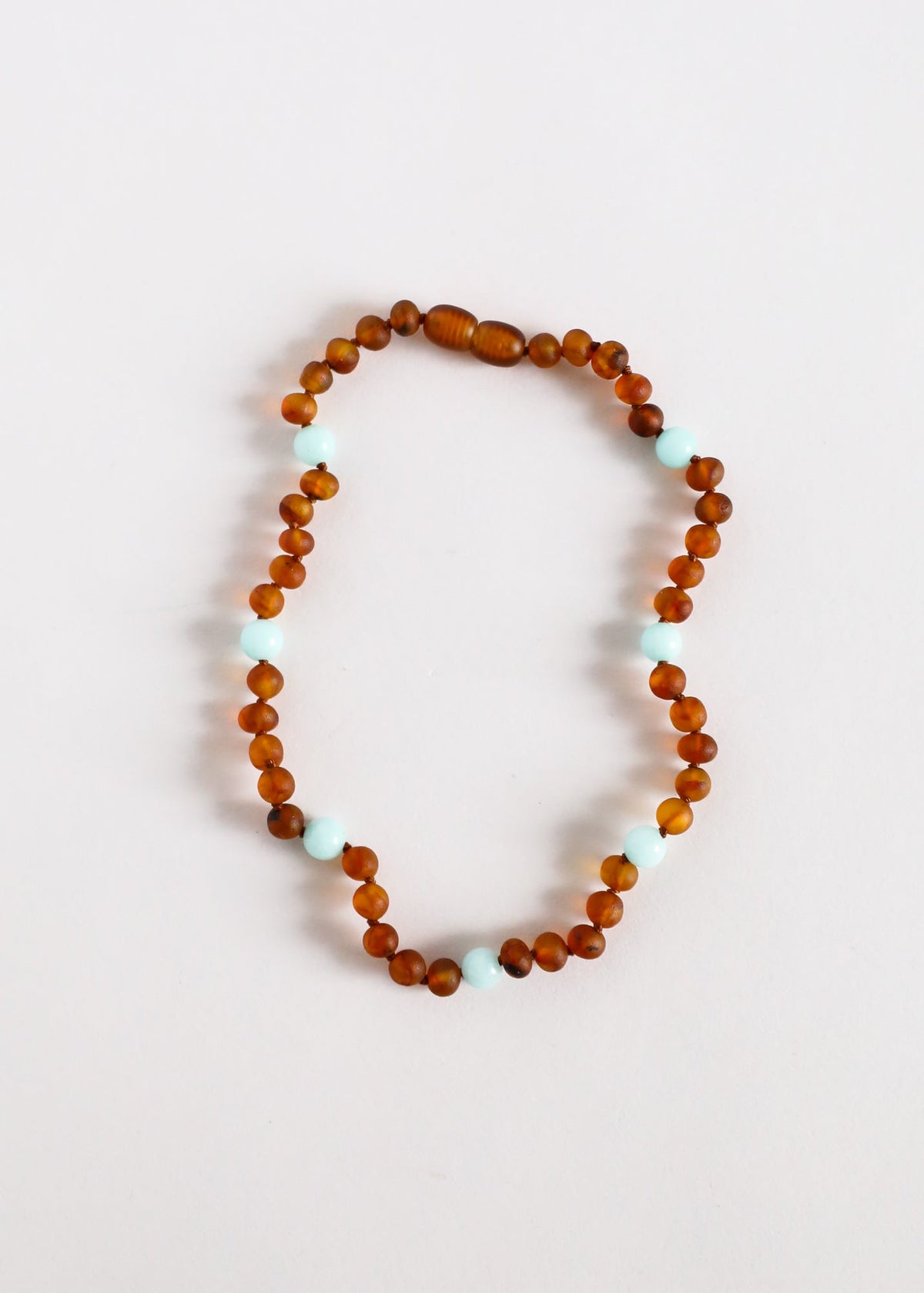 Cognac amber bead necklace with pale blue amazonite accent beads