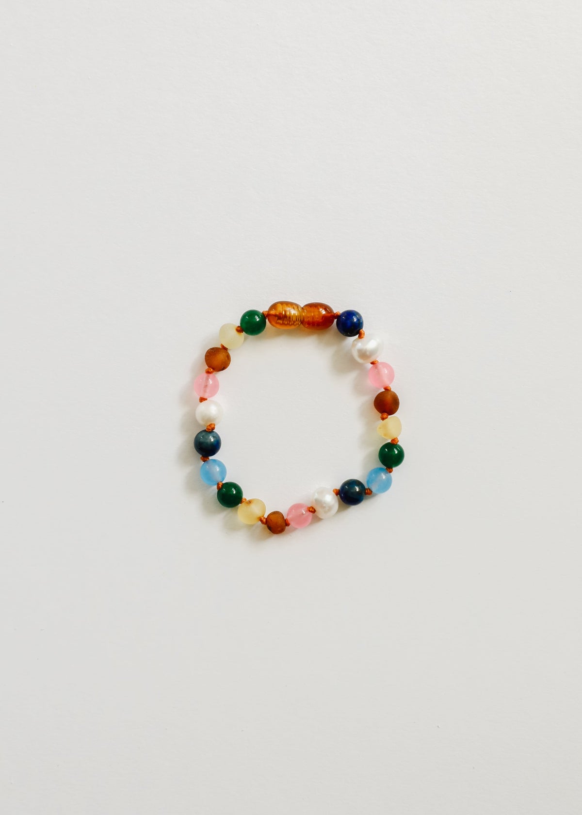 Colorful beaded bracelet with orange, green, blue, and pink round stones