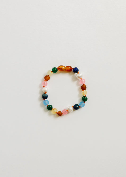Colorful beaded bracelet with orange, green, blue, and pink round stones