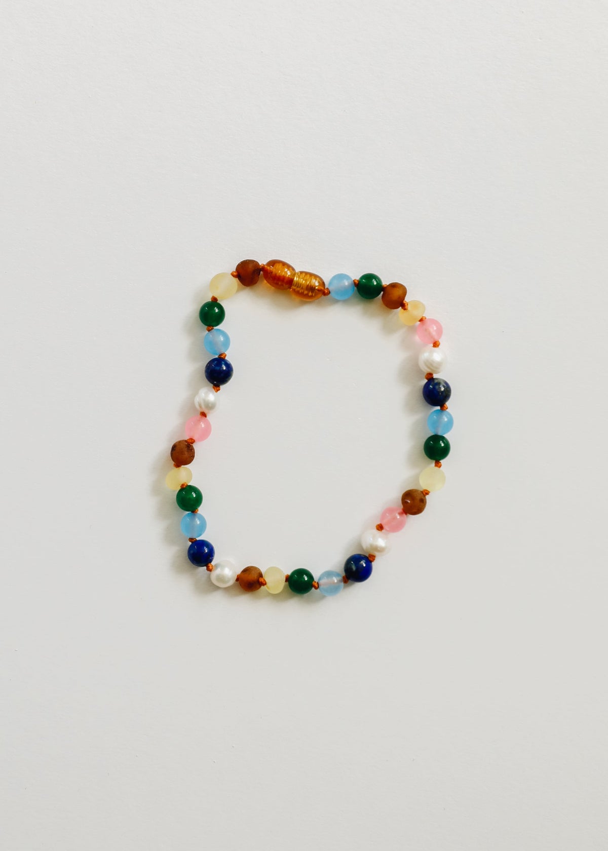 Multi-color beaded bracelet with orange, green, blue, and white accents