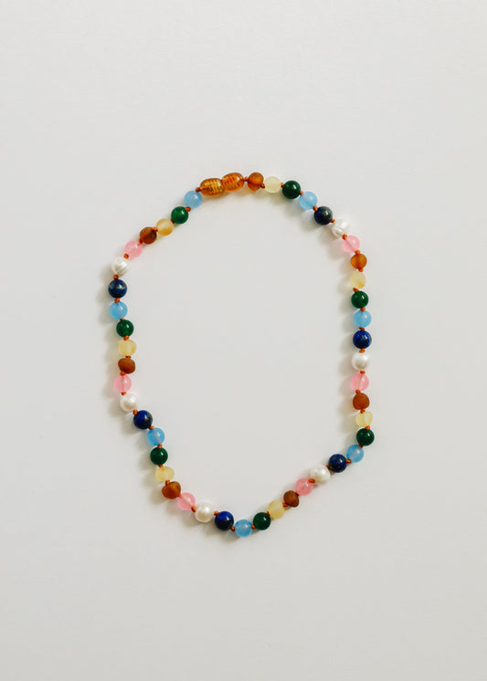 Multicolor beaded necklace with amber-toned beads and pearl-white accents