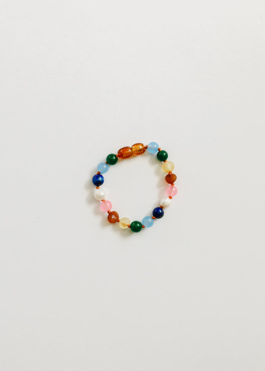Beaded bracelet with orange, green, blue, white, and pink stones and pearls
