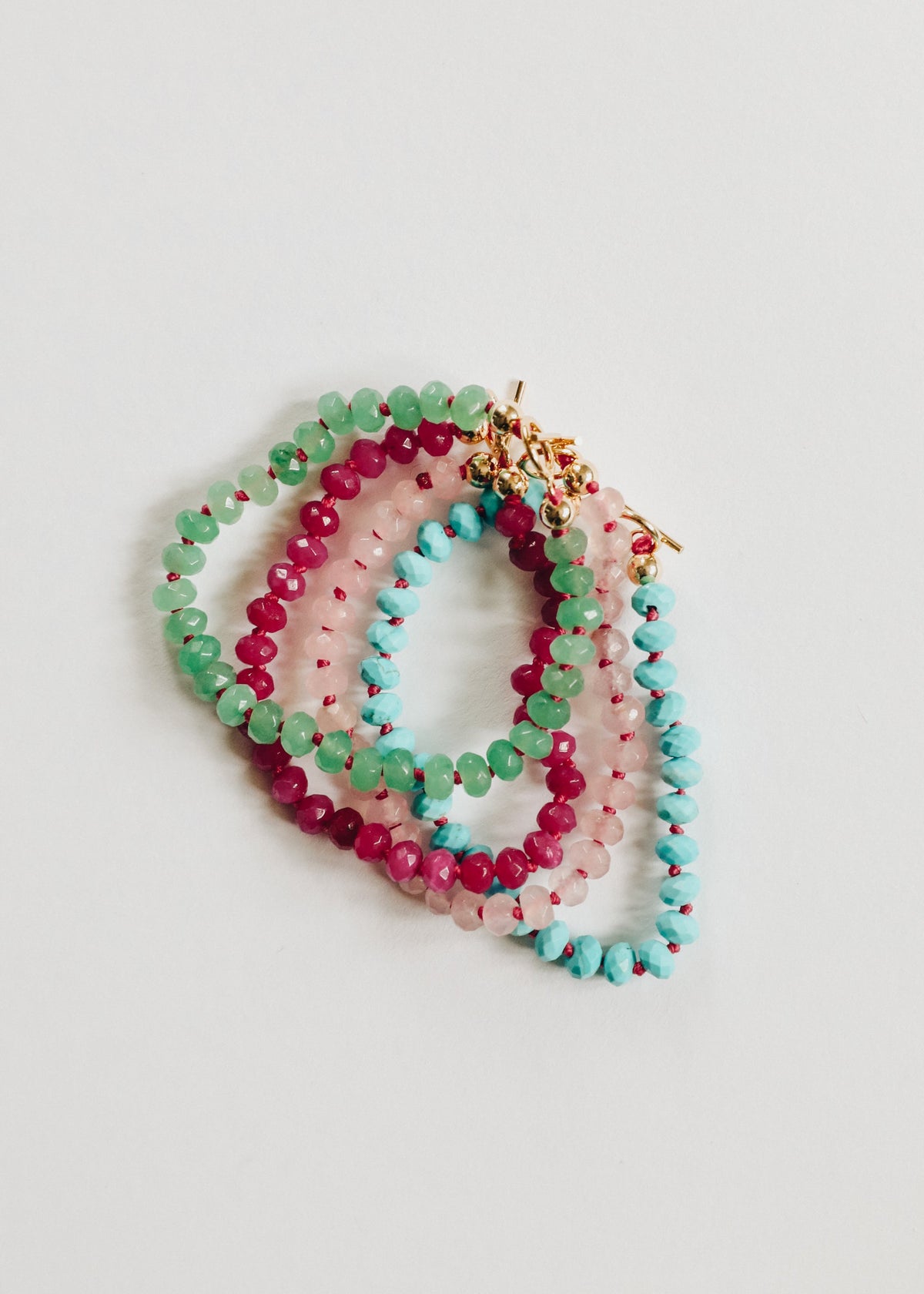 Multicolor gemstone beaded bracelets with gold star toggle clasp