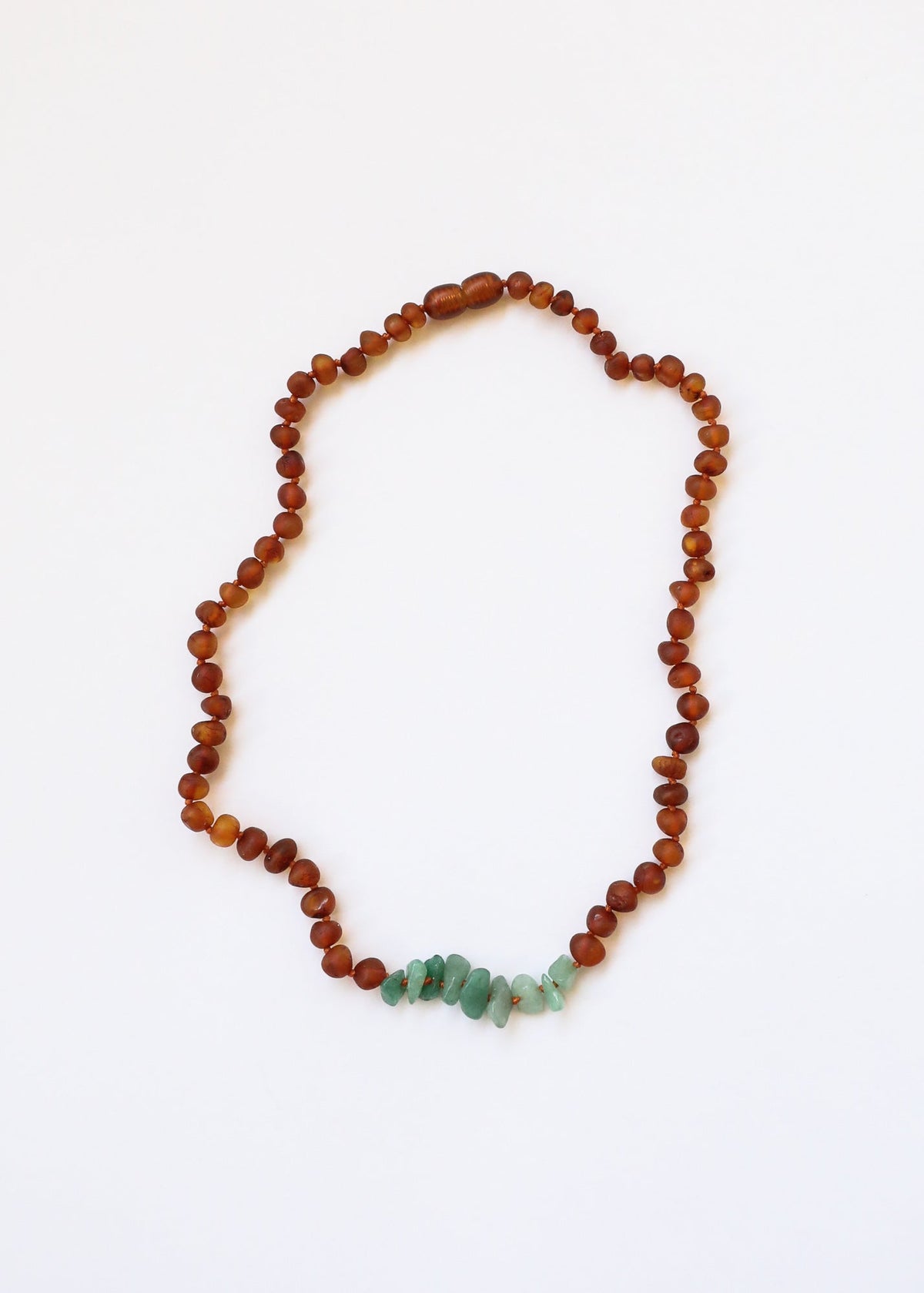 Raw amber bead necklace with green aventurine chip accents, full loop