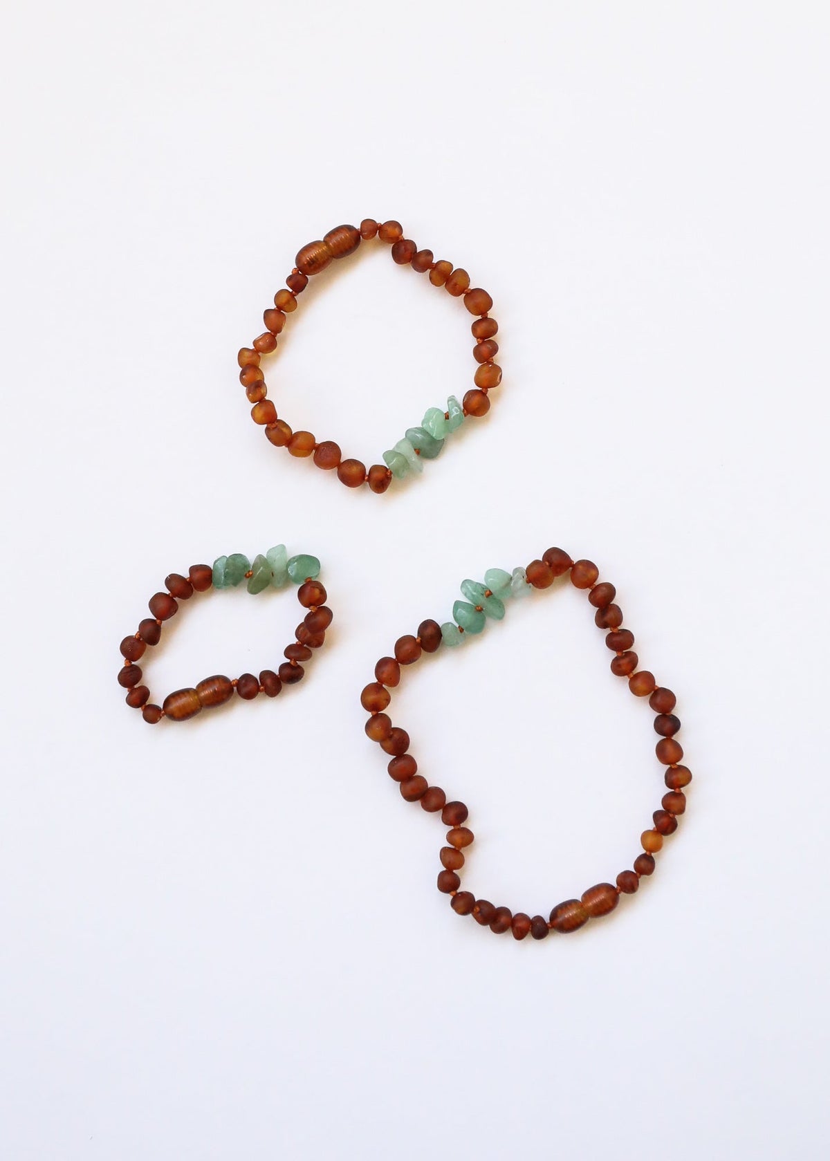 Three raw amber bead bracelets with green aventurine chips