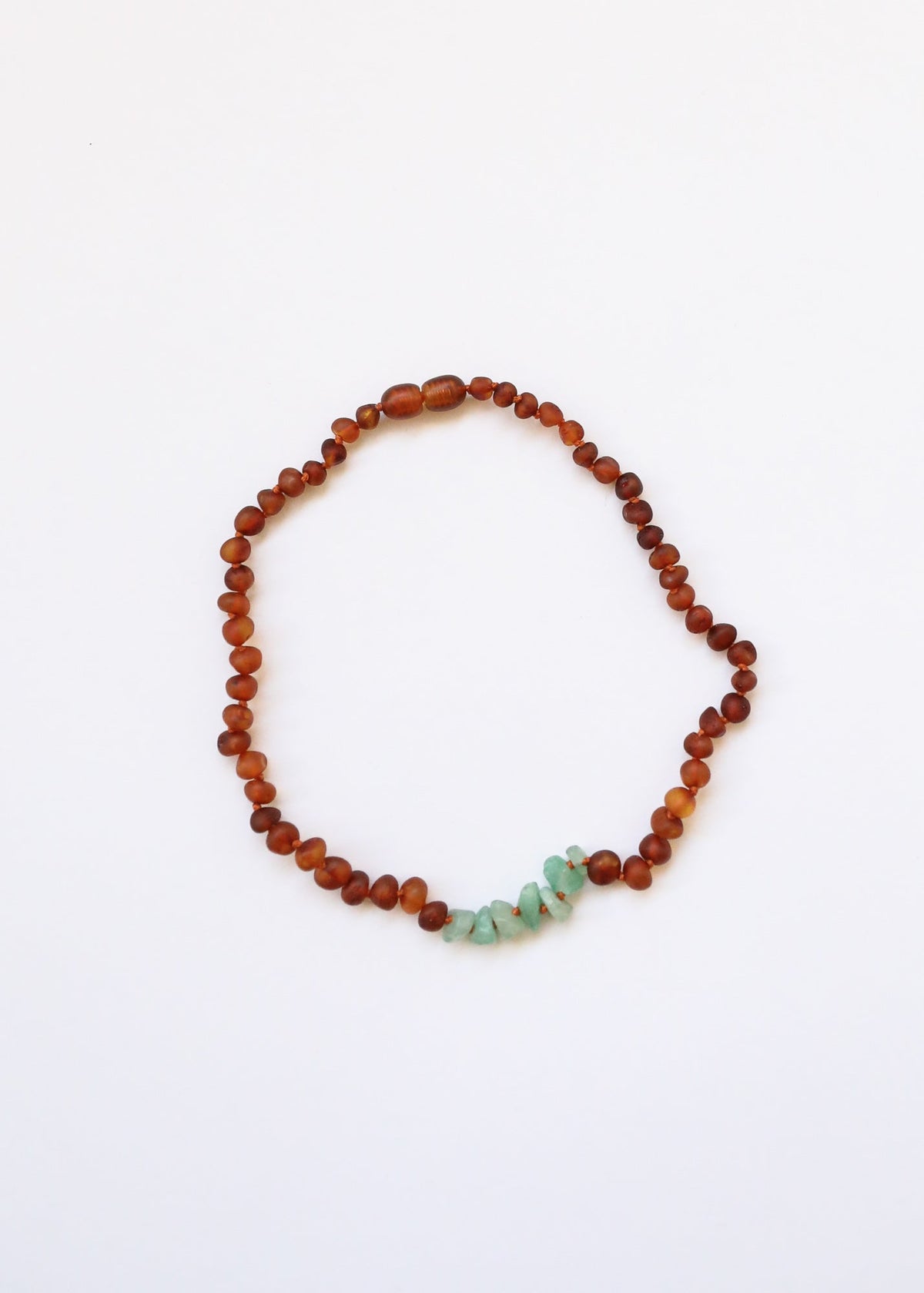 Raw amber bead necklace with green aventurine chip accents, single strand loop