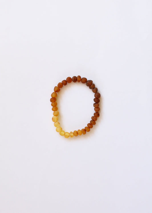 Two-tone amber beaded adult bracelet in dark brown and honey-yellow beads