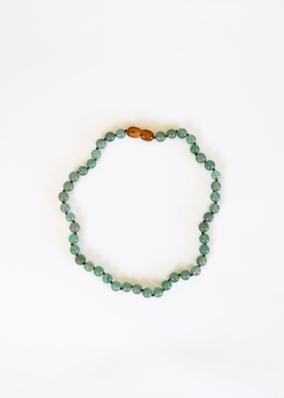 Aventurine bead necklace with small amber/gold centerpiece bead accents