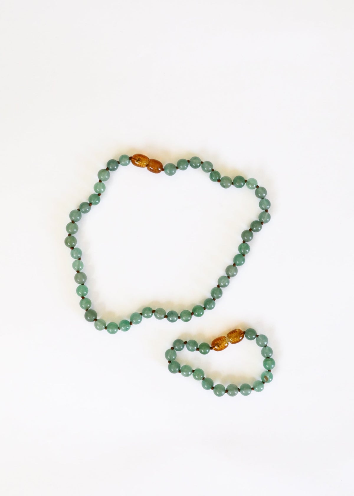 Aventurine bead necklace with amber/gold beads, shown with small bracelet