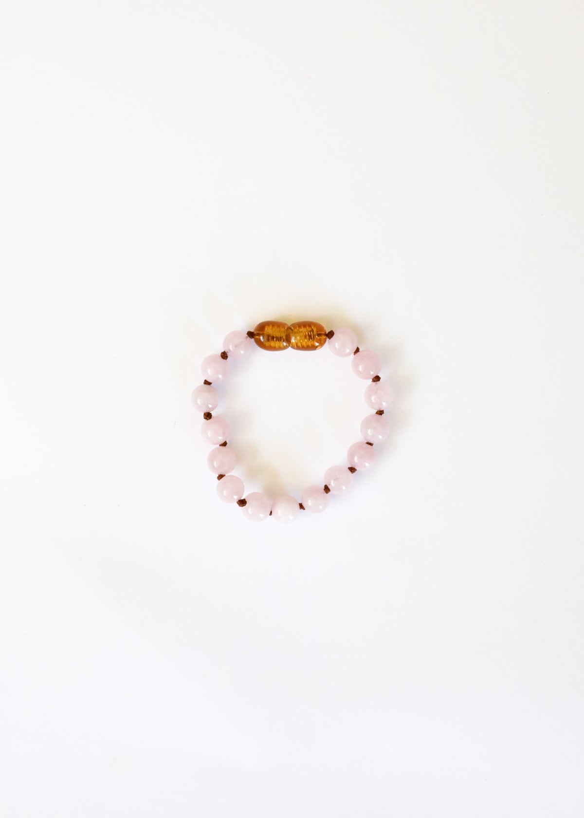 Rose quartz bead bracelet with gold-tone clasp bead center