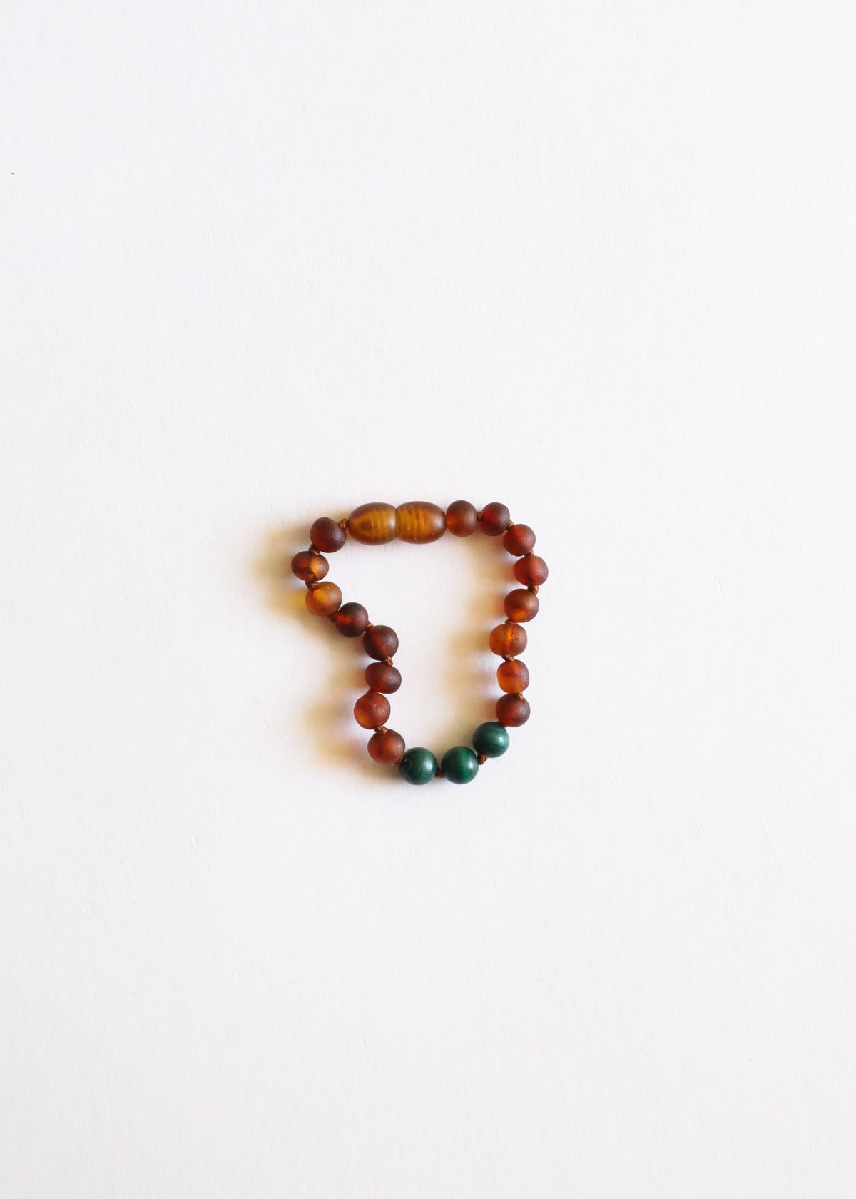 Amber and malachite bead bracelet, round dark cognac beads with green accents