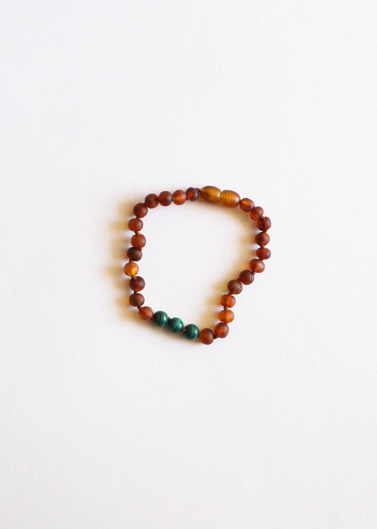 Round amber bead bracelet with green malachite beads, small loop on string