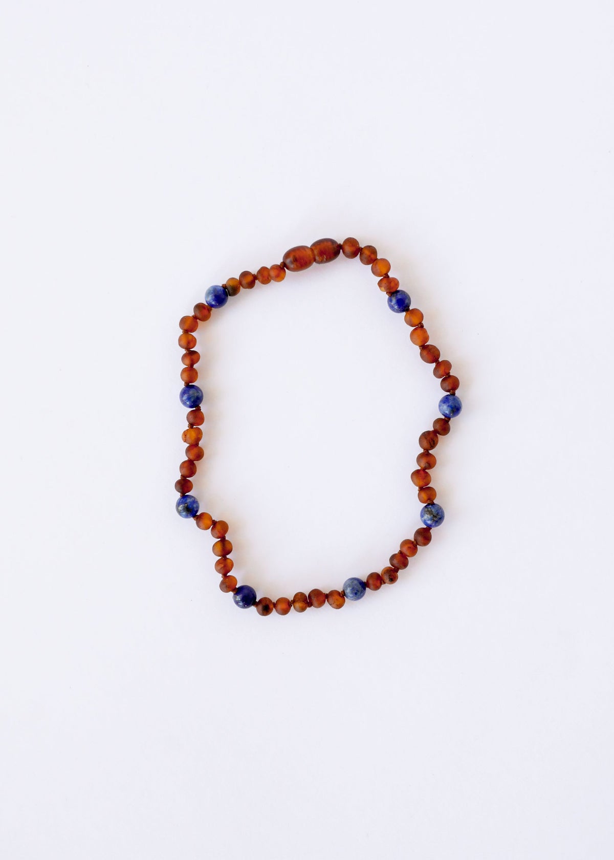 Amber and lapis lazuli bead halo necklace, orange-brown and blue round beads