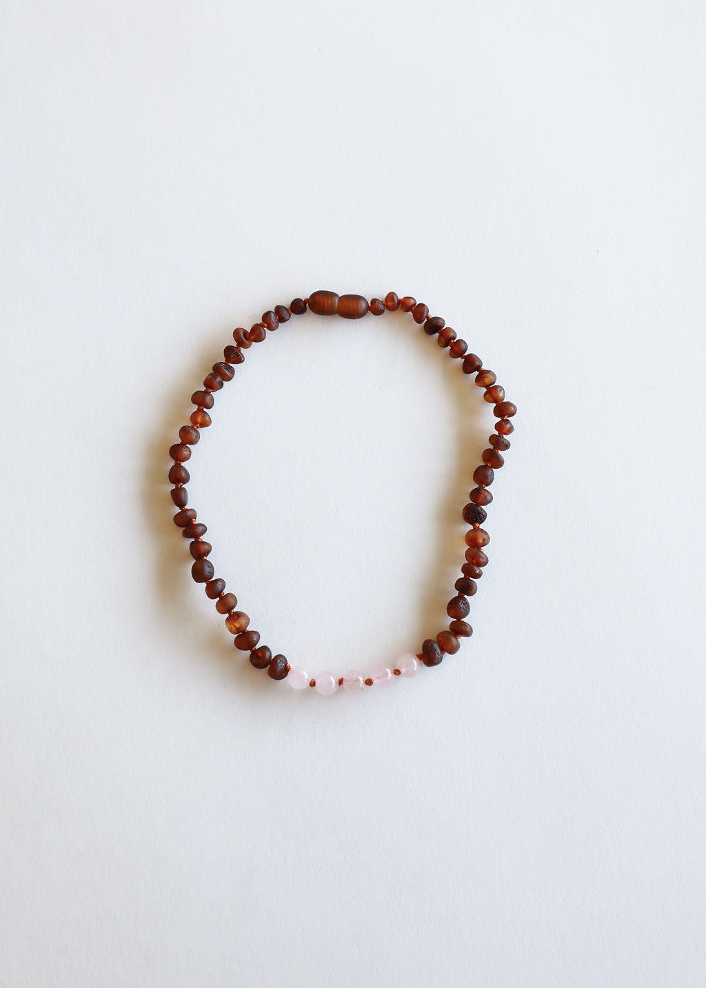 Amber and pink bead necklace, single loop shape