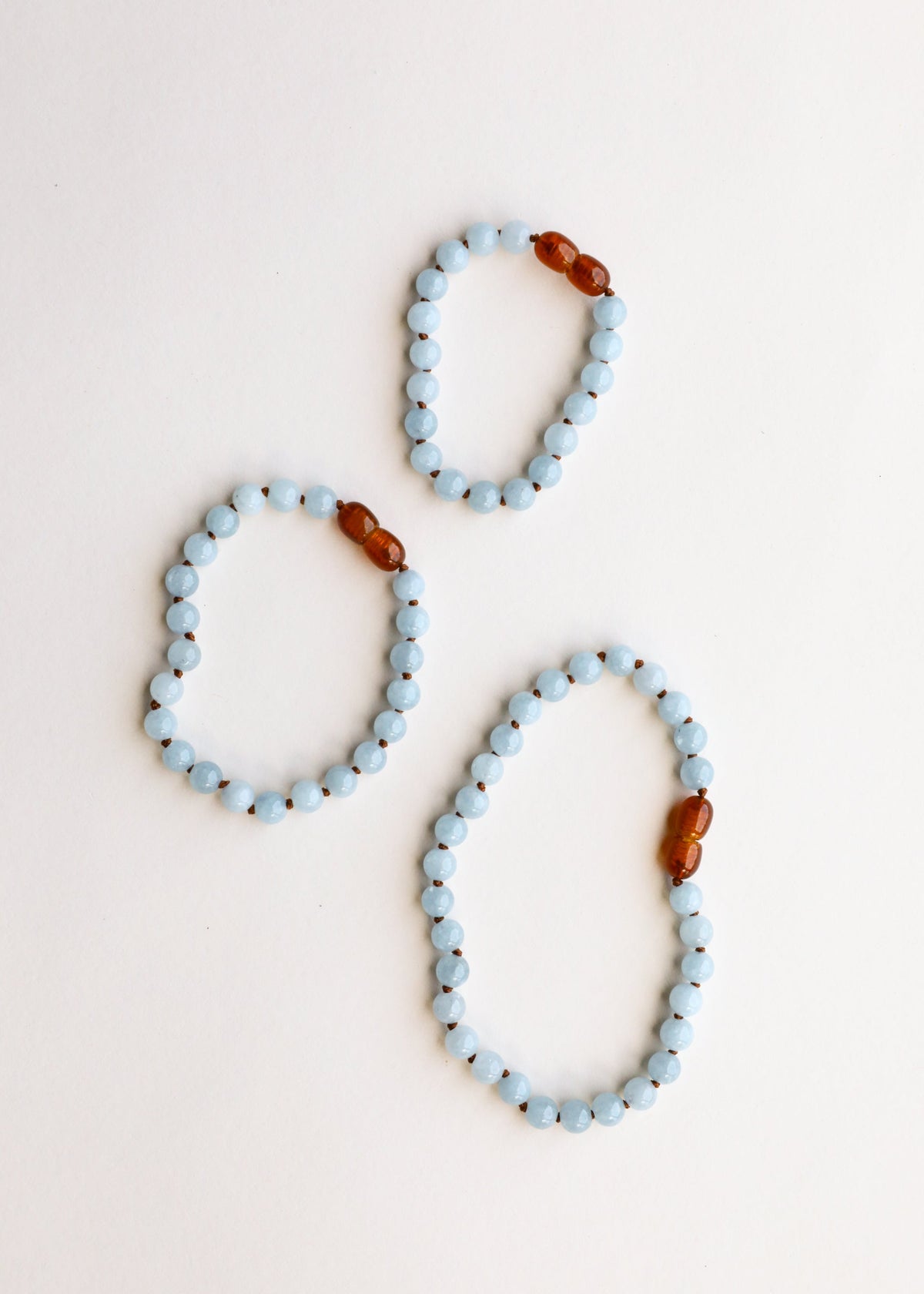 Aquamarine bead bracelets, three loops with small amber accent beads
