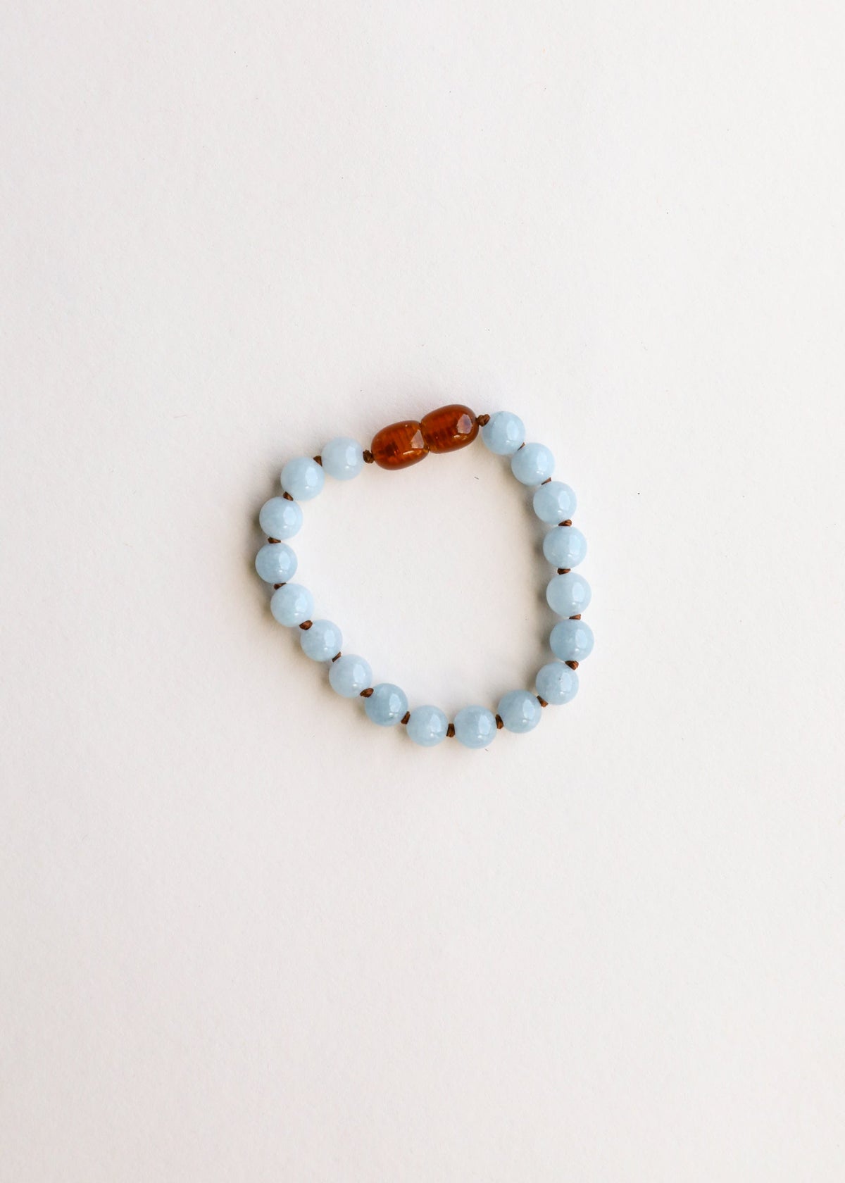 Aquamarine bead bracelet loop with amber bead accents at the top