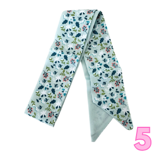 Women’s printed scarf in light blue with scattered green floral and leaves