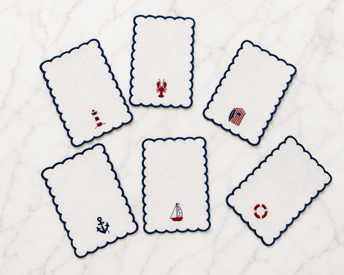 Set of 6 embroidered cocktail napkins with scalloped edges and nautical icons: lobster, anchor, ship