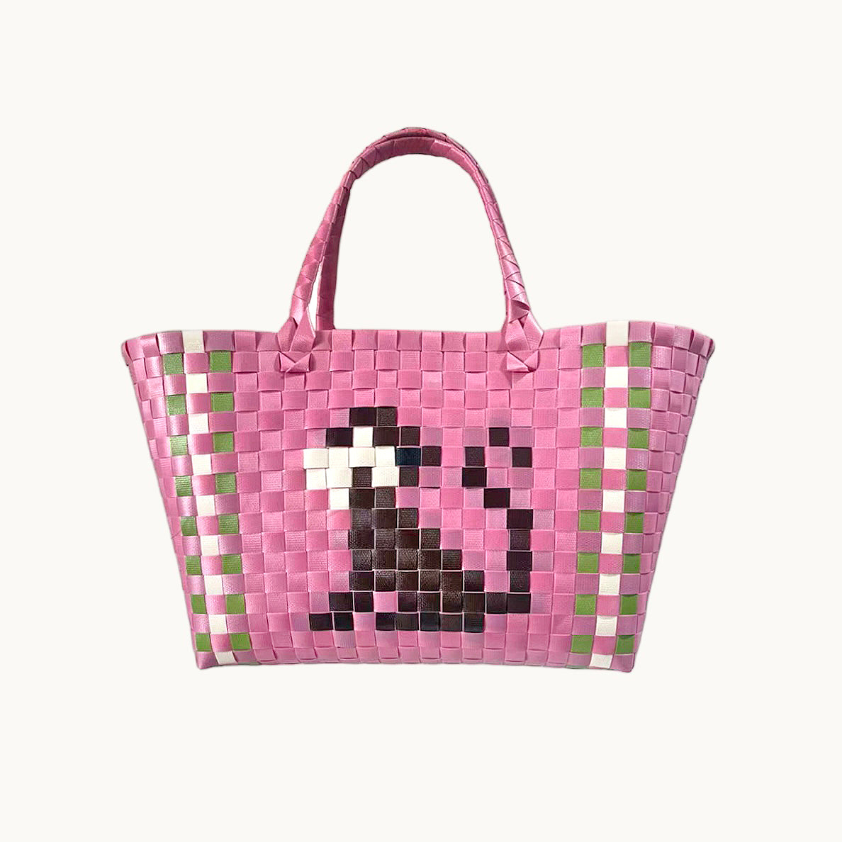 Pink woven basket bag with green check border and pixel-style monkey face front panel