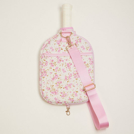 Floral neoprene pickleball paddle bag with pink adjustable strap and front zip pocket