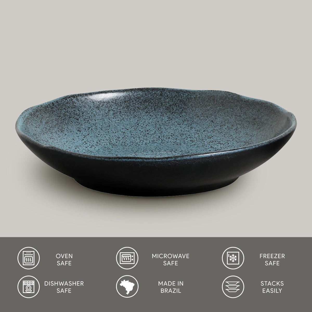 Teal reactive-glaze pasta plate, wide low rim and speckled texture