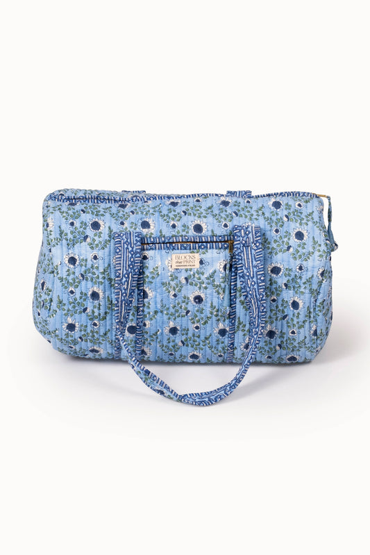 Quilted ocean-blue block print duffle bag with top zipper and stitched handles