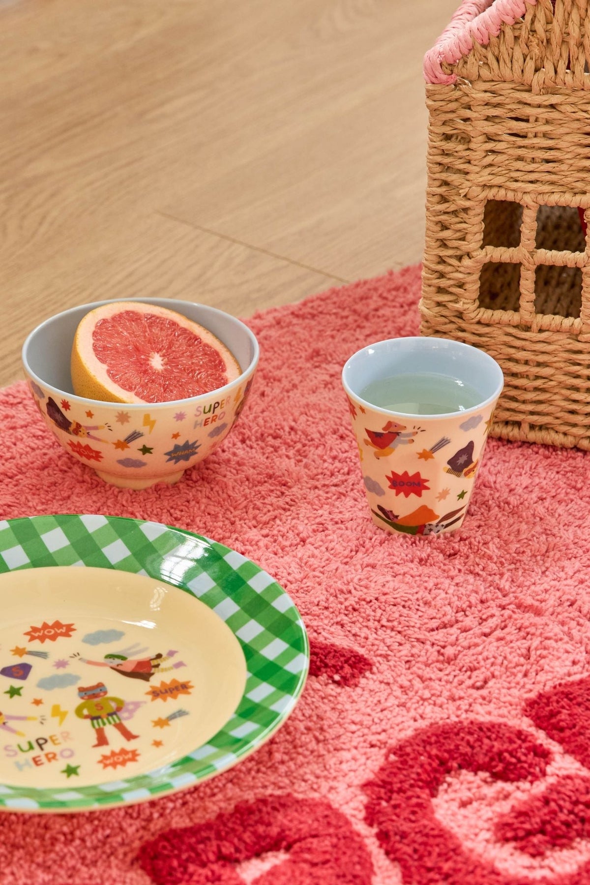 Hero-print melamine bowl with soft blue rim, shown with coordinating cup