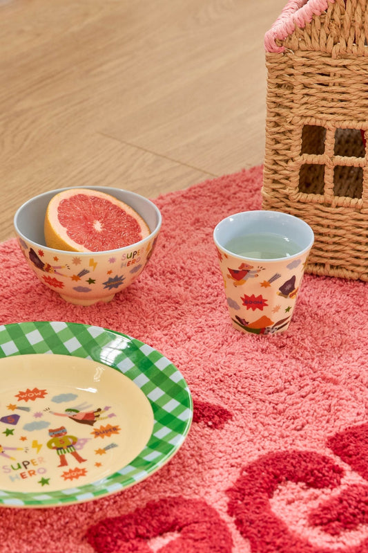 Hero-print melamine bowl with soft blue rim, shown with coordinating cup