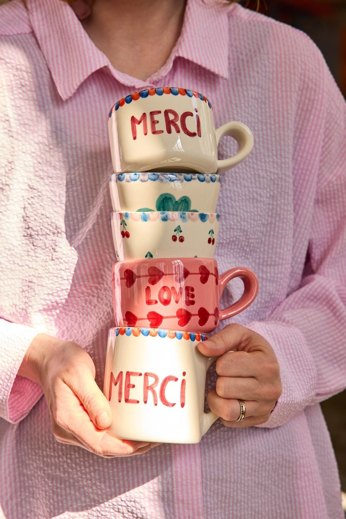 Set of two small ceramic cups, LOVE and MERCI, with heart and flower designs