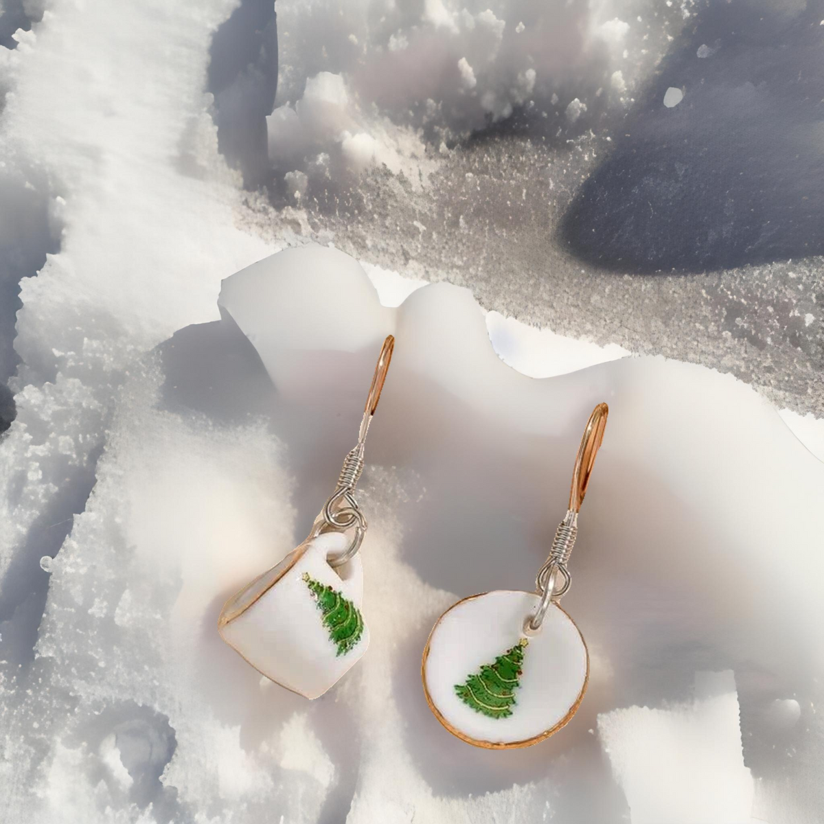 Dangle earrings featuring white tea cup and round charms with green tree detail