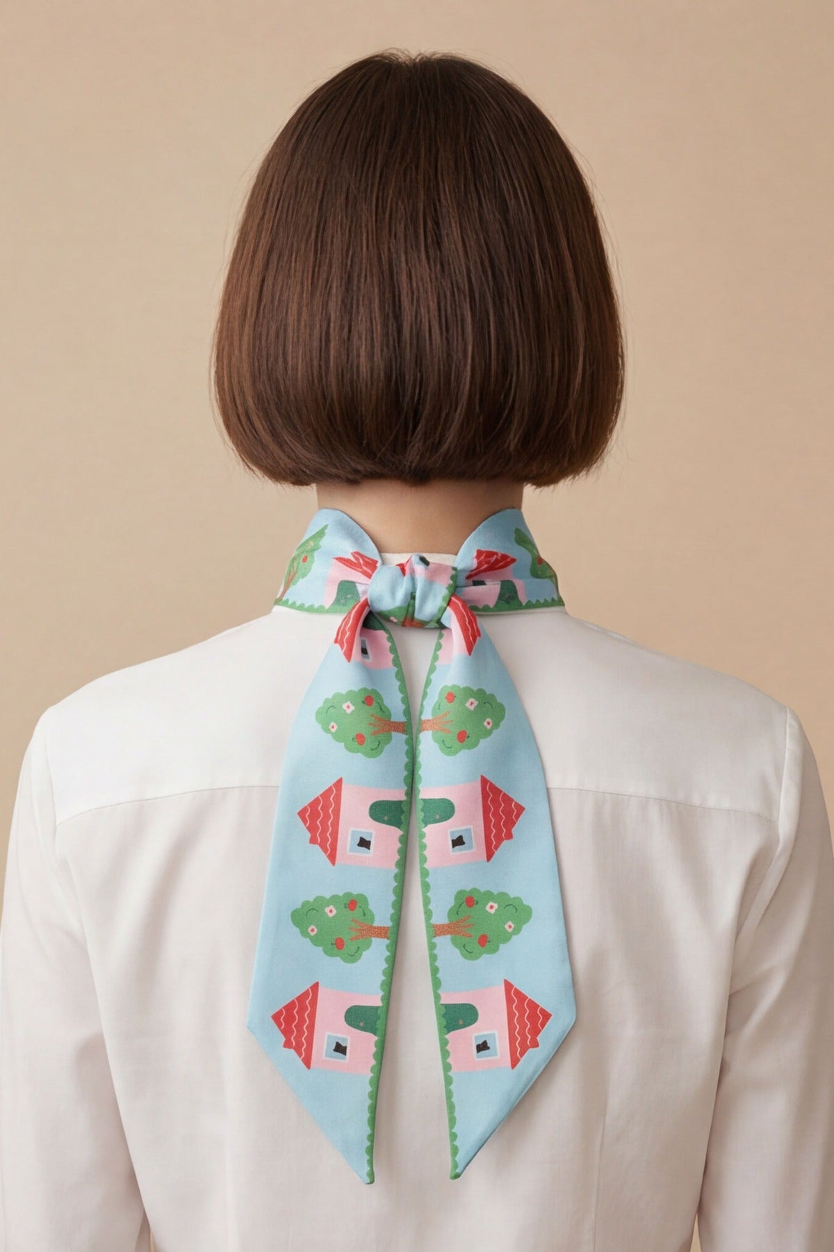 Back-tie twilly ribbon scarf in light blue and pink with house and flower pattern