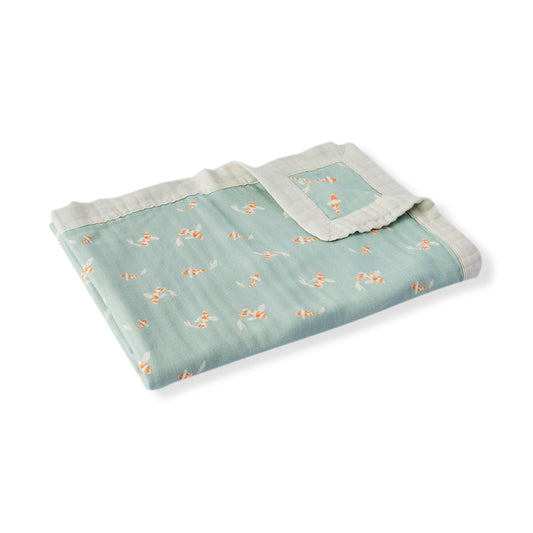 Teal baby lovey blanket with orange koi fish print and off-white scalloped trim