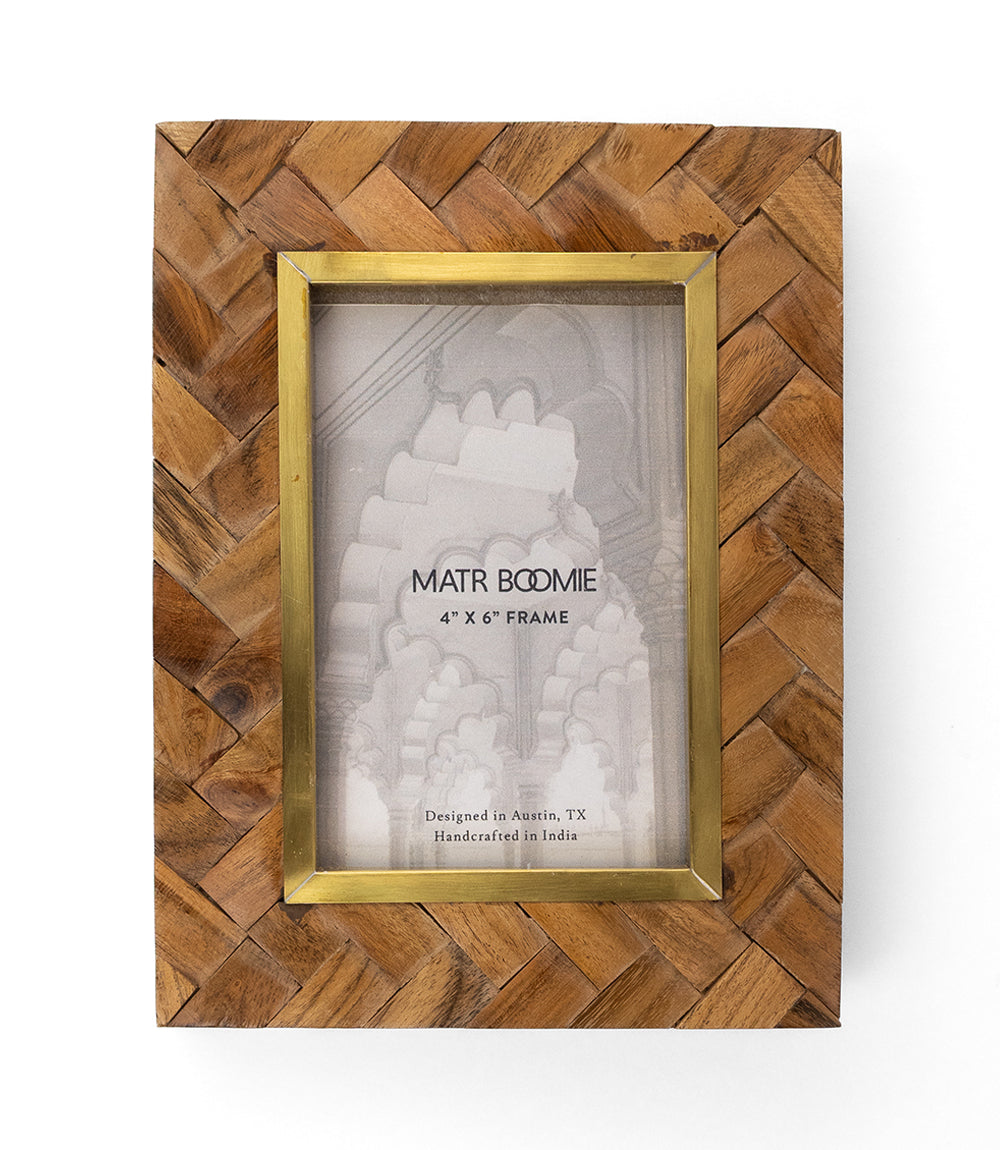 Carved wooden 4x6 picture frame with brass-toned border and glass-front mat insert.