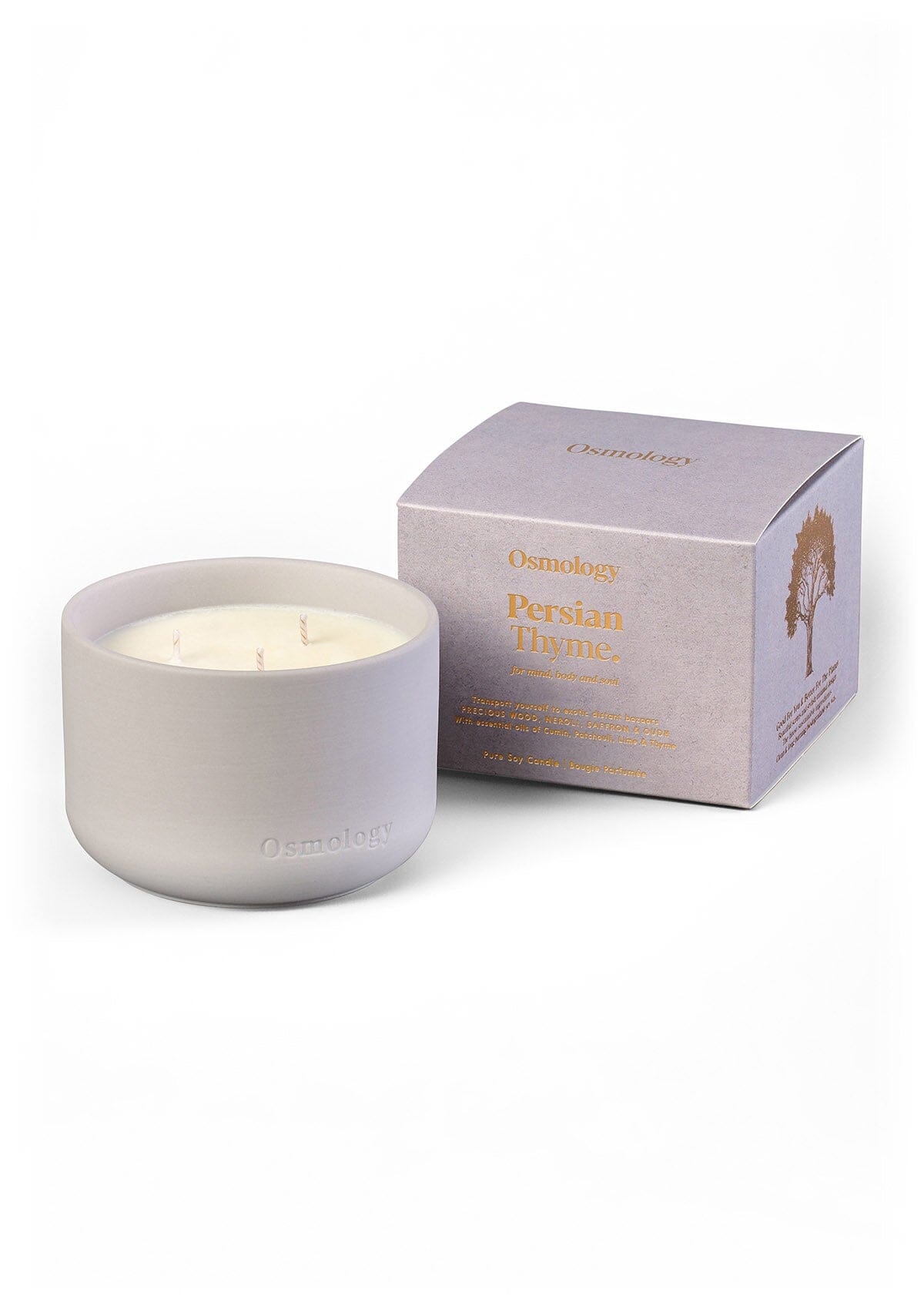 Triple-wick scented candle in a white wax jar, with three visible wicks