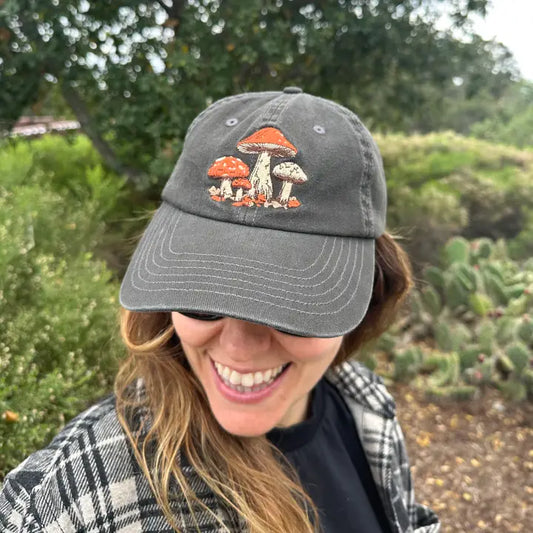Gray baseball cap with orange mushroom patch embroidery, curved brim