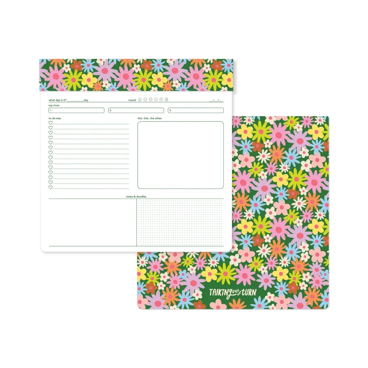 Floral notepad showing open ruled pages and matching flower-pattern cover