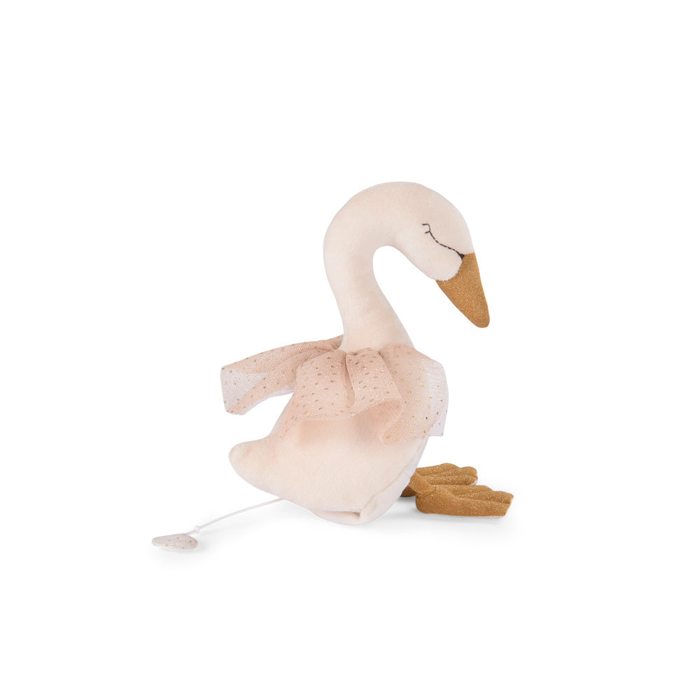 Musical swan plush kneeling with pale pink tutu, brown beak, and brown shoes